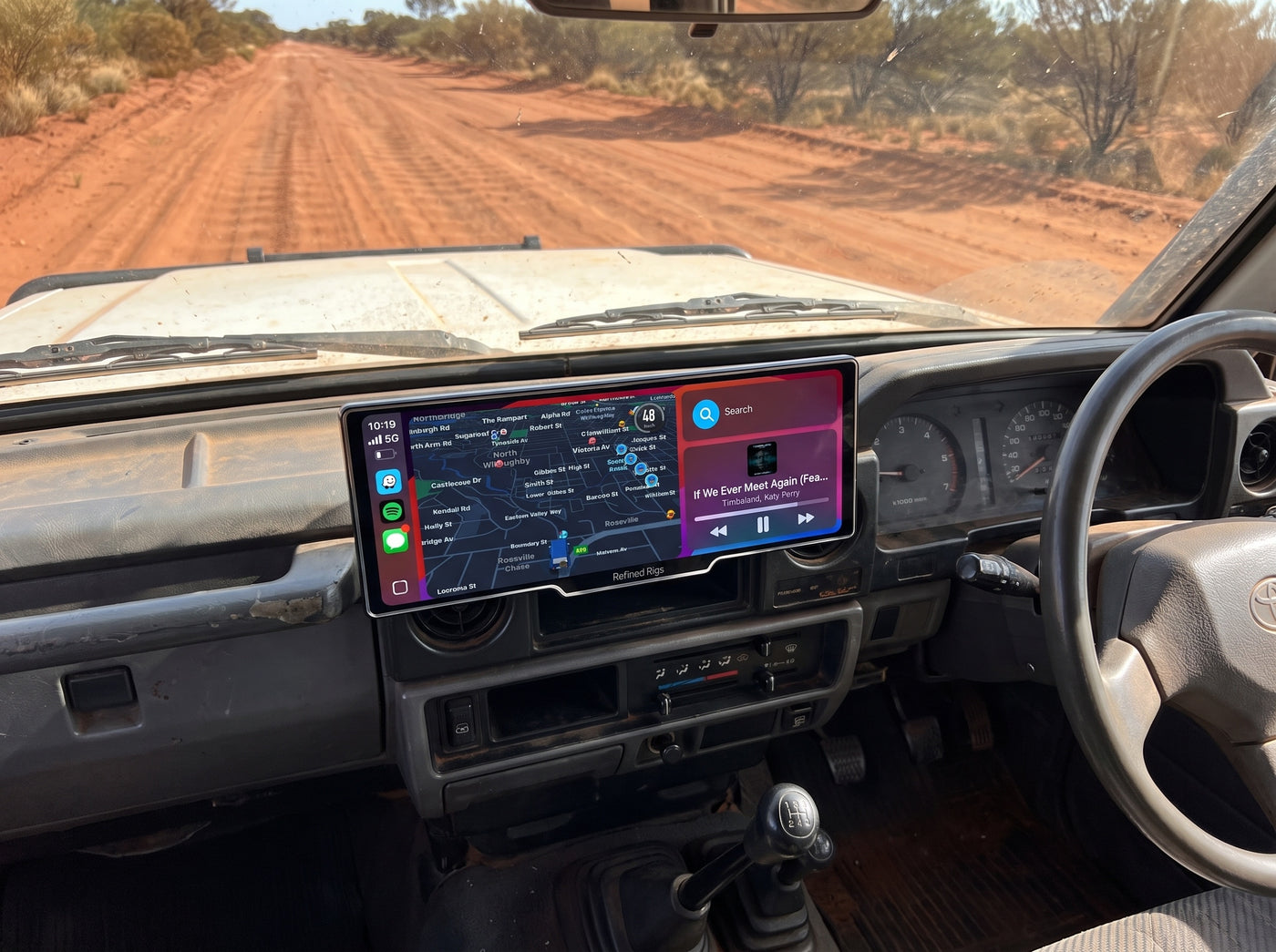 Evara Display mounted securely on a 4WD dash on a corrugated outback road
