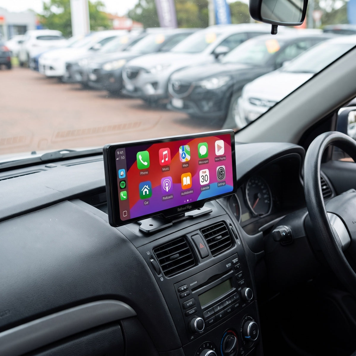 Evara Display wireless CarPlay screen mounted on a car dashboard