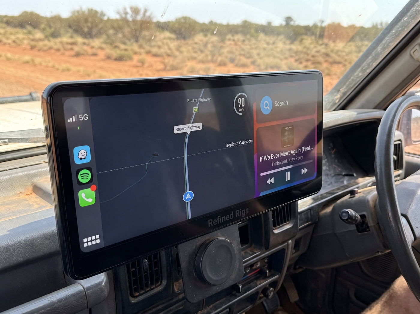 Evara Display showing Stuart Highway navigation in a 4WD towing a caravan