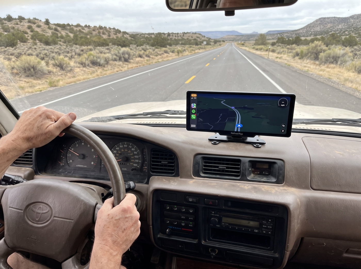 Driver's view of the Evara Display centred on the dash of a Toyota Land Cruiser
